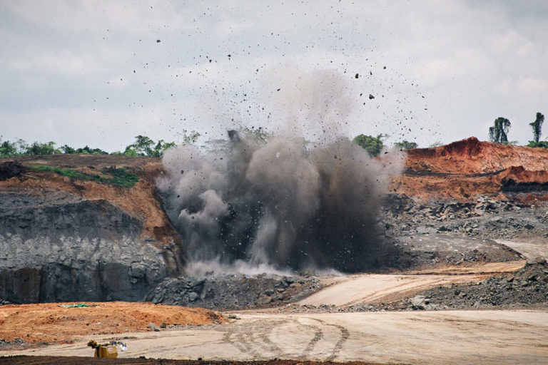 Clearing the site with dynamite to access the vein of coal in East Kalimantan, Indonesia.