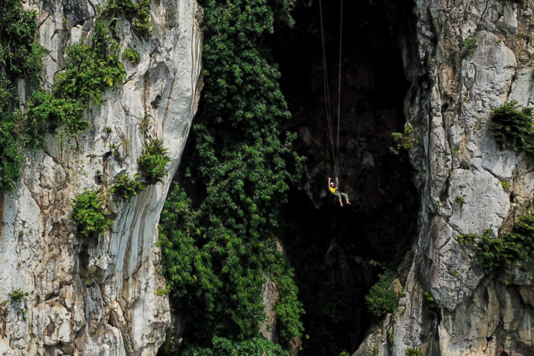 Highlining, an outdoor activity that helps with conservation efforts, in the Karst Citatah area, Padalarang, West Java. Image by Donny Iqbal/Mongabay.