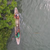 Fishers in a boat in the Malampaya Sound mangroves.